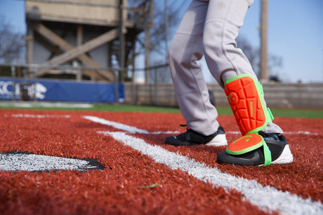 baseball player wearing protective leg guard