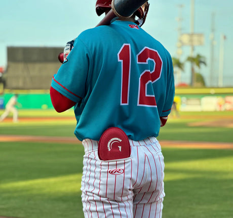 baseball player with sliding mitt tucked in back pocket